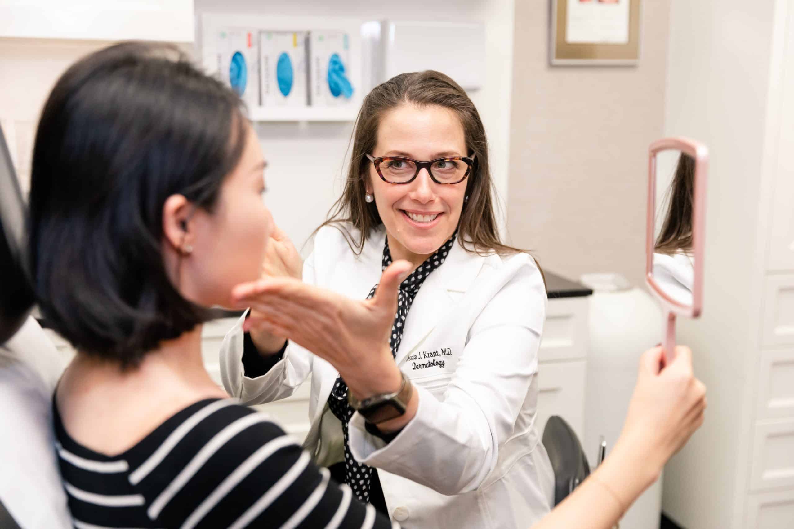 patient reviewing results after a fraxel repair procedure