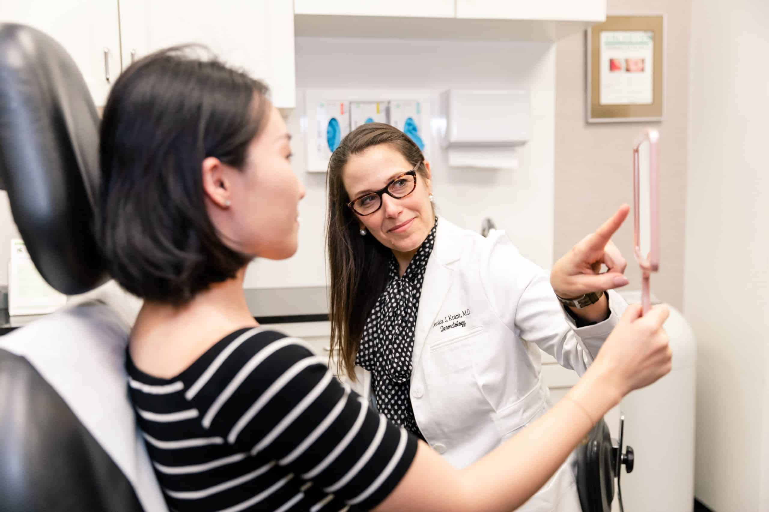 patient reviewing her clear+brilliant laser treatment results patient reviewing her clear+brilliant laser treatment results