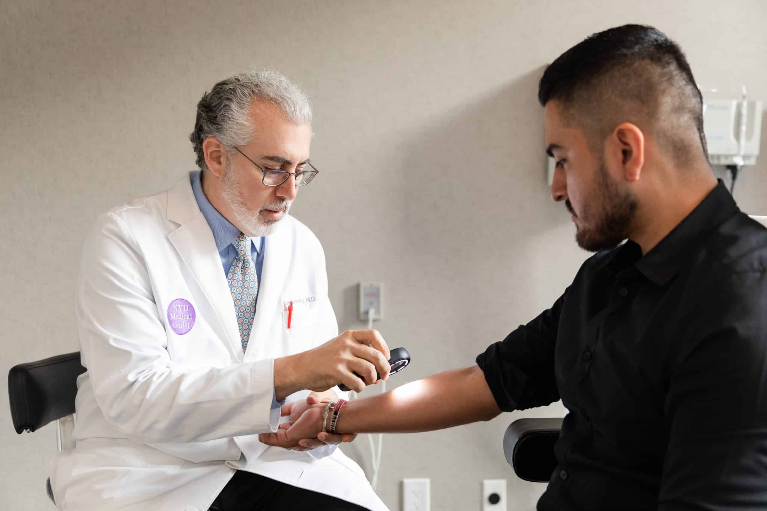 dermatologist with his patient