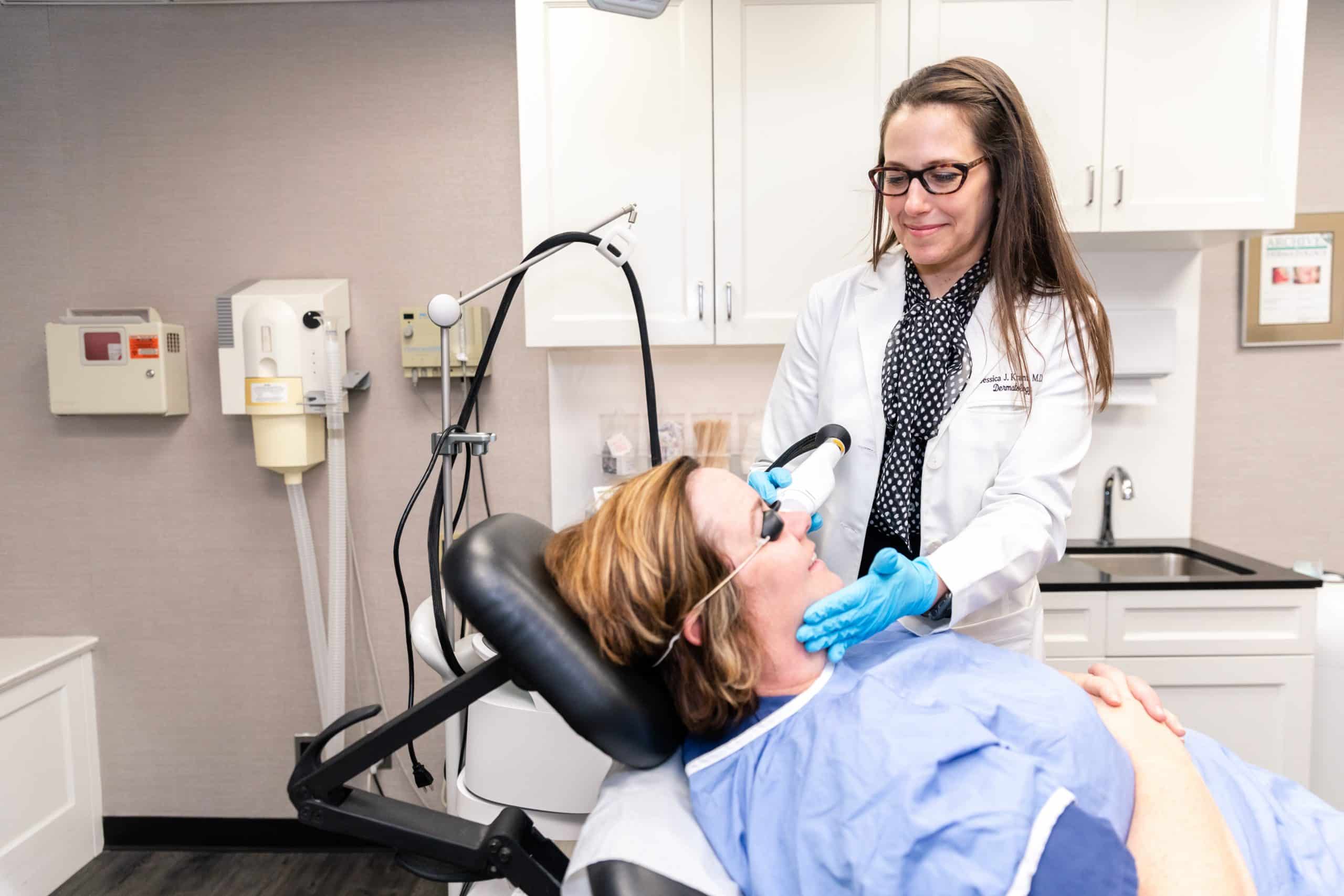 Image showing dermatologist, Dr.Krant giving laser treatment to one of her patients, New York, NY