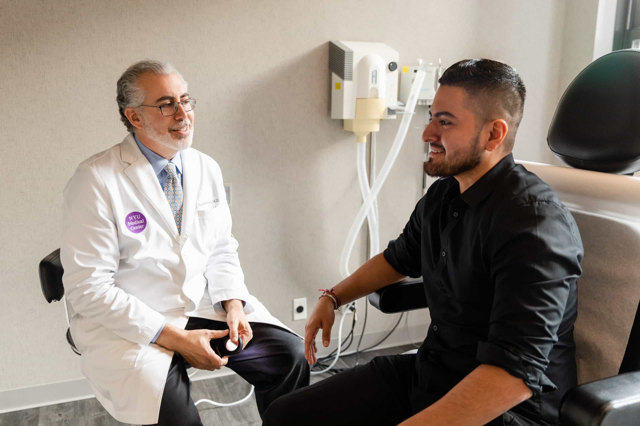 patient consulting with a NYC dermatologist for nail treatments 