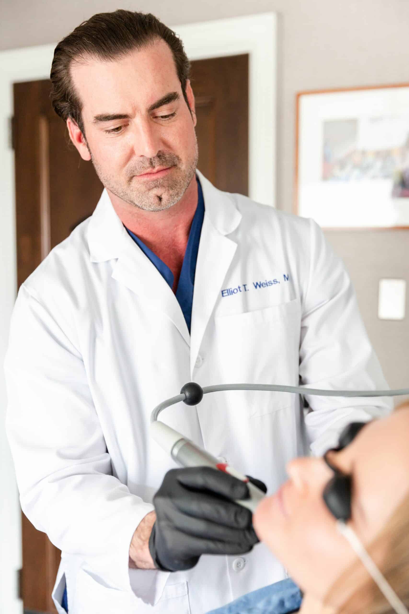 Infini-genius-for-skin-rejuvenation-Weiss-LSSC-NYC-7 dr wang performing a laser pore treatment in new york
