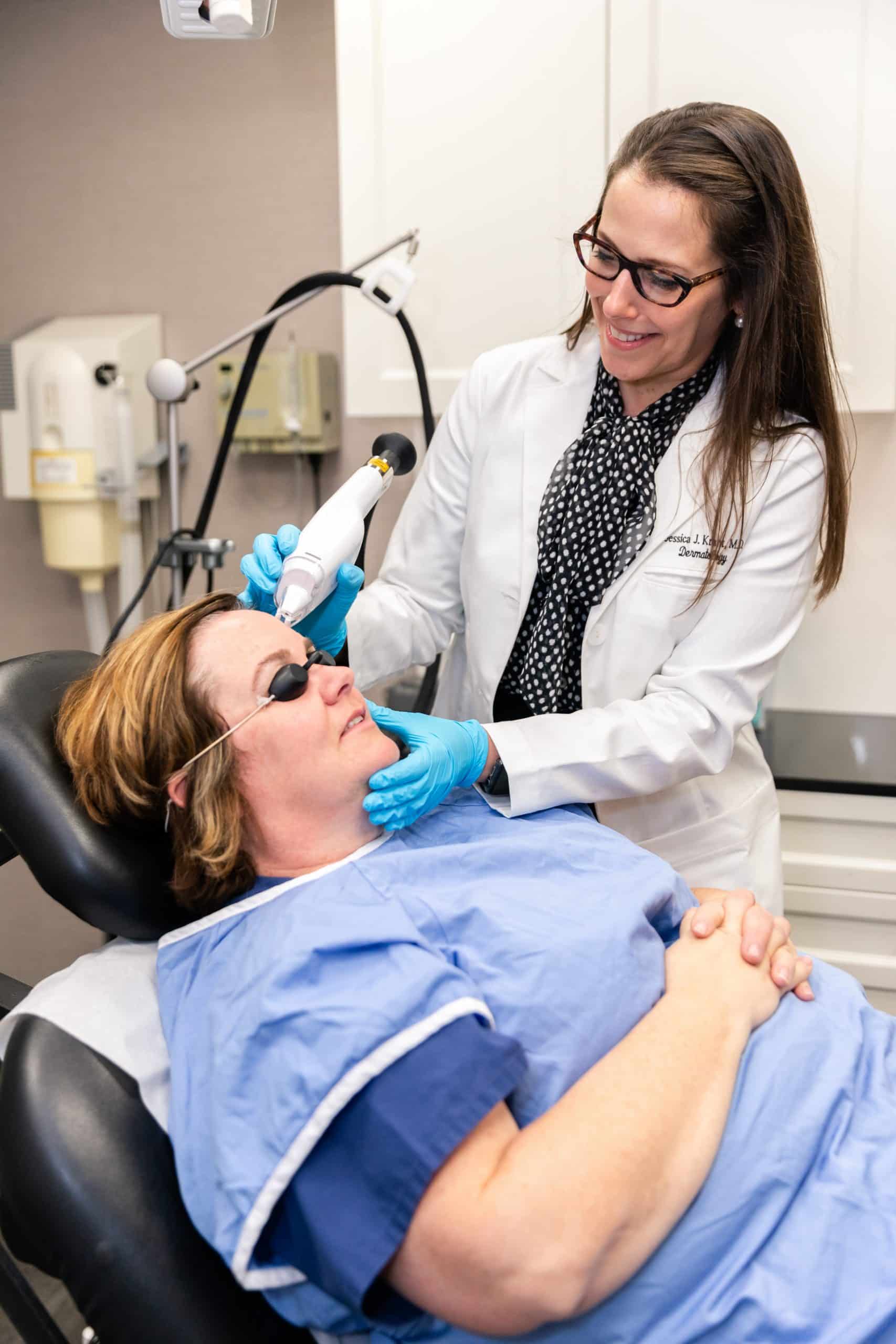 dermatologist performing a LaseMD Ultra laser treatment on a patient in NYC