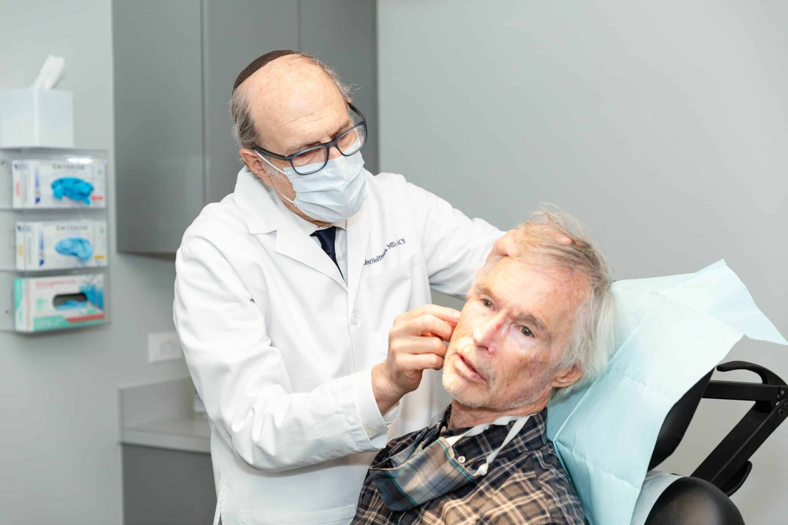 Patient-consultation-plastic-surgery-exam-chair-Hoffman-LSSC-NYC-2 otoplasty consultation for an older patient