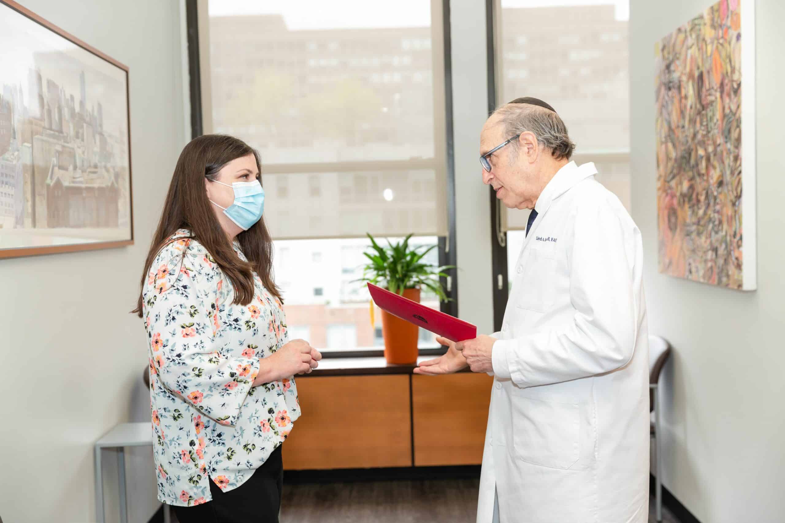 Patient-consultation-plastic-surgery-standing-Hoffman-LSSC-NYC-2 breast lift consultation in new york