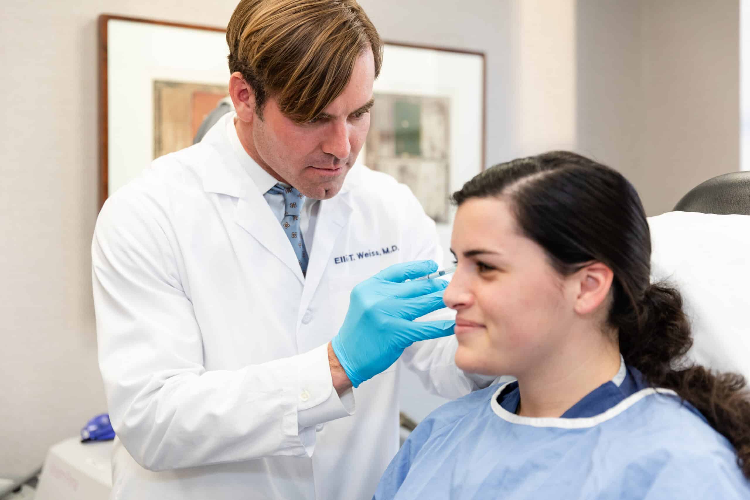 dermatologist consulting with a millennial patient interested in cosmetic procedures in NYC