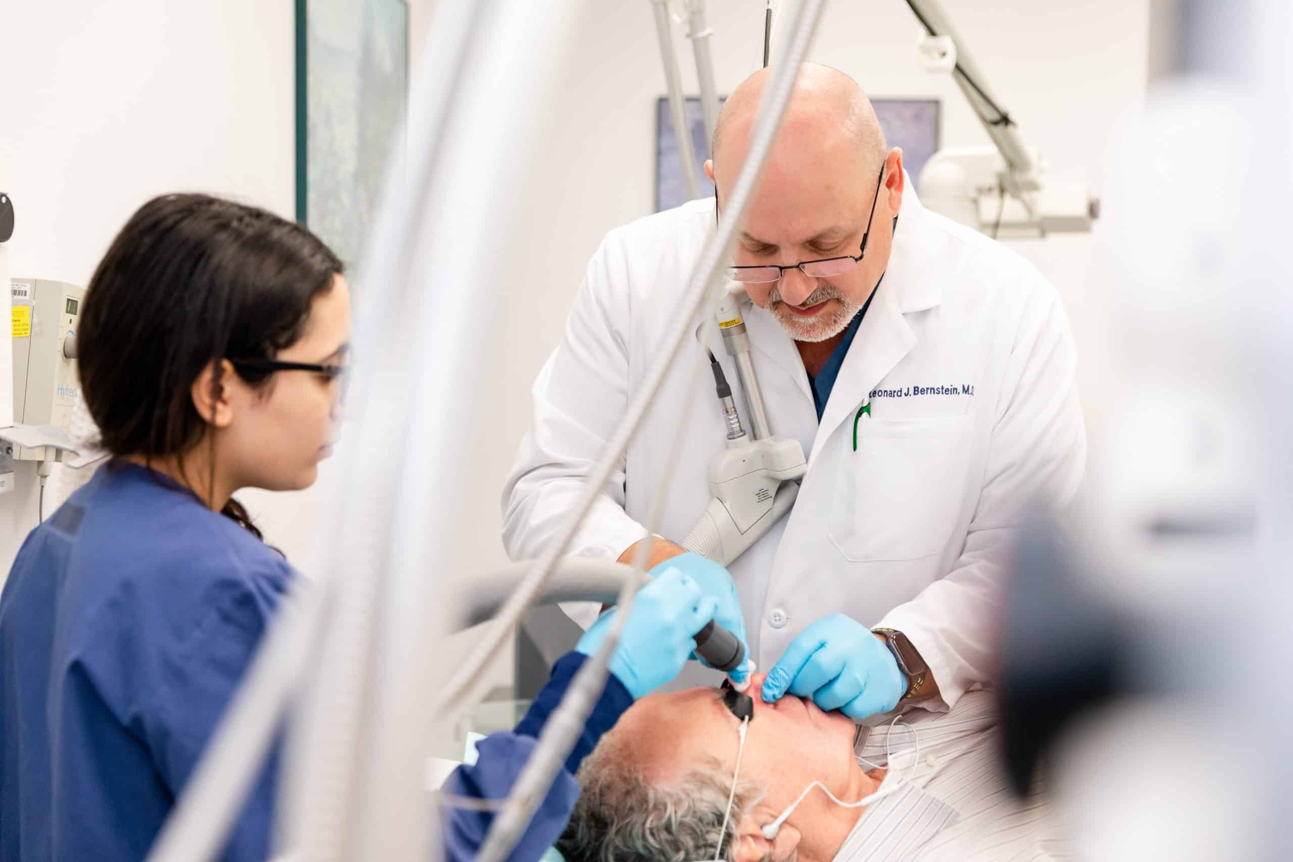 dermatologist performing a cosmetic treatment on a male patient in NY, NY