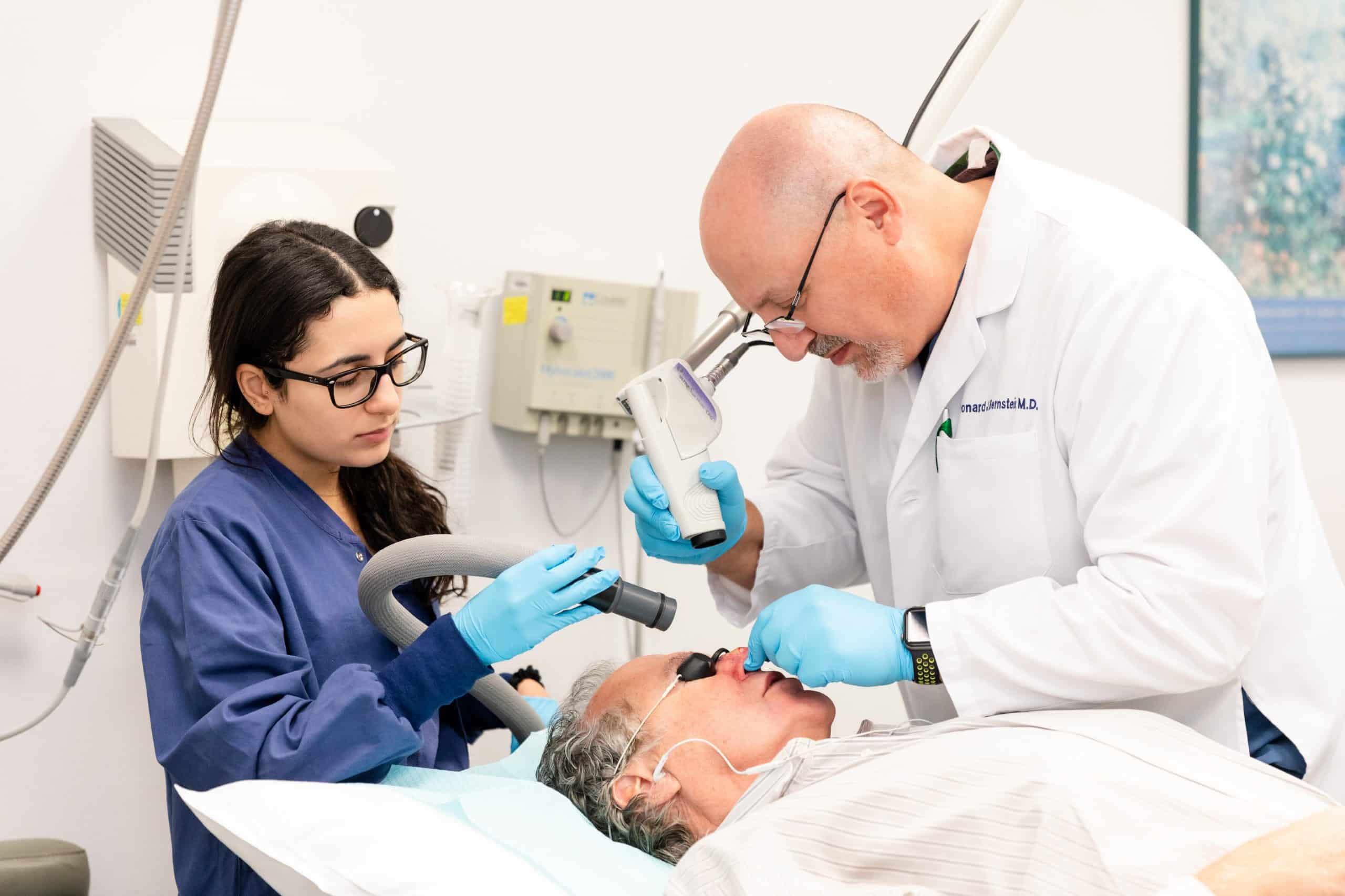 cosmetic laser procedures-New York City Dr. Bernstein performing a cosmetic laser procedure on a patient's face in NY, NY