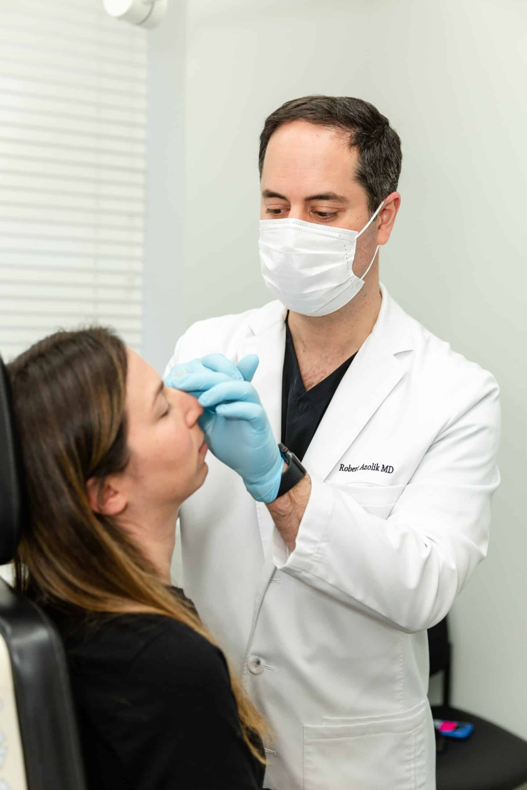 Dr. Anolik performing a cosmetic treatment on a patient in NYC, NY