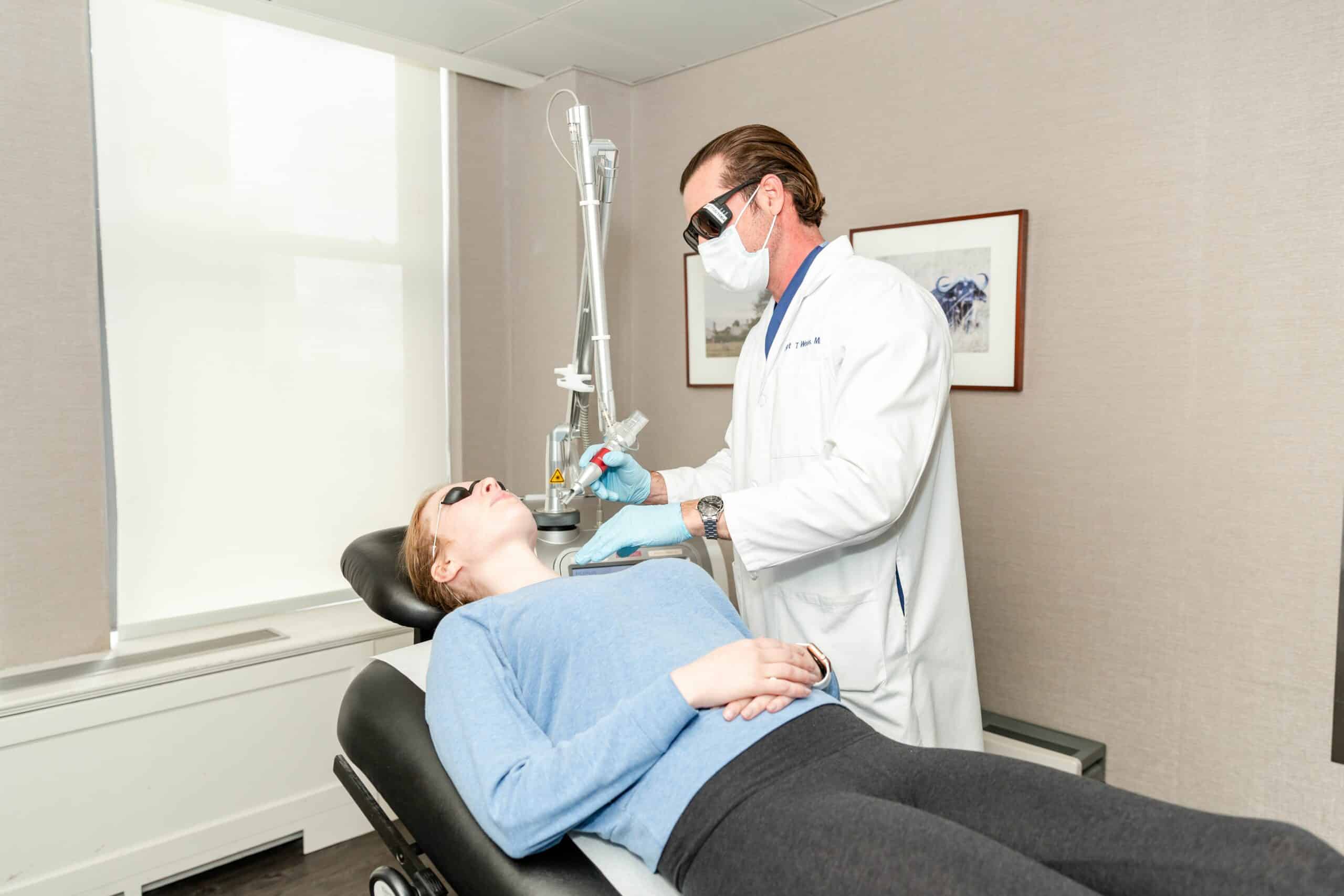 patient receiving a hyperpigmentation laser treatment from a NY dermatologist