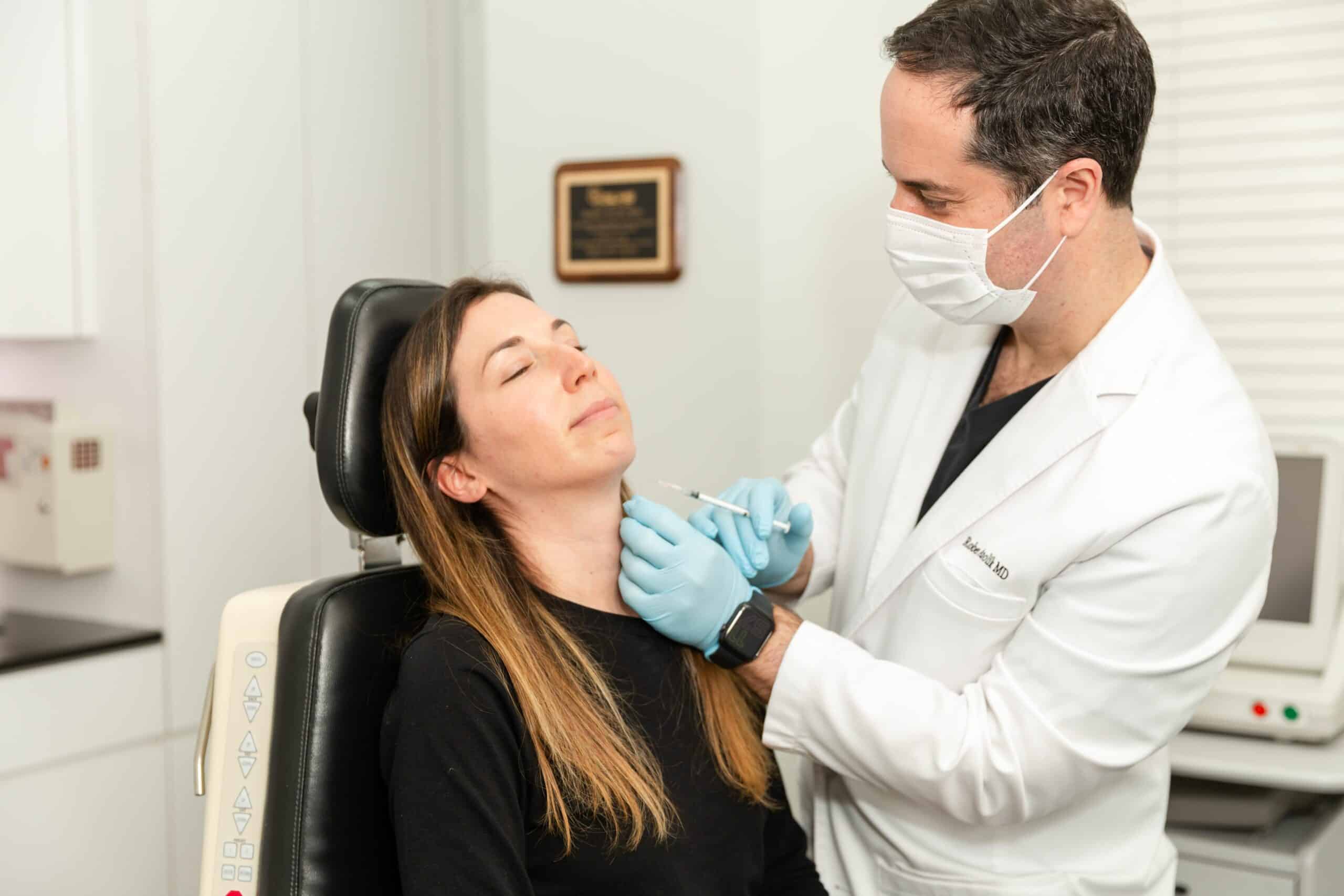 doctor performing laser scar treatment in New York City