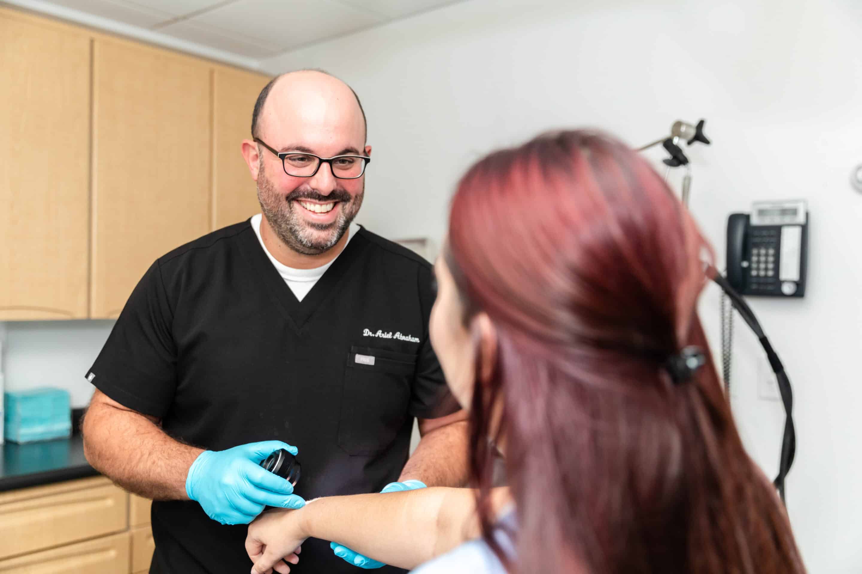 LSSCNY dermatology specialist talking to a patient